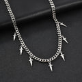 Silver chain necklace with spike-like pendants on a black background